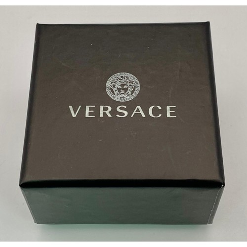 635 - A very desirable VERSACE gold plated stud earrings with the iconic Medusa symbol. Diameter: 11 mm. I... 