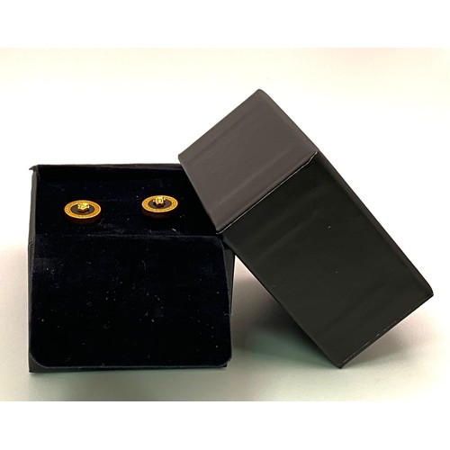 635 - A very desirable VERSACE gold plated stud earrings with the iconic Medusa symbol. Diameter: 11 mm. I... 