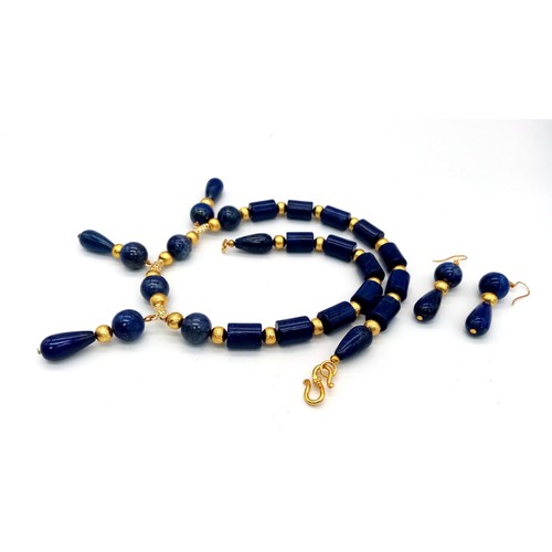 204 - A regal, lapis lazuli and gilded spacers necklace and earrings set in a presentation box. Necklace l... 