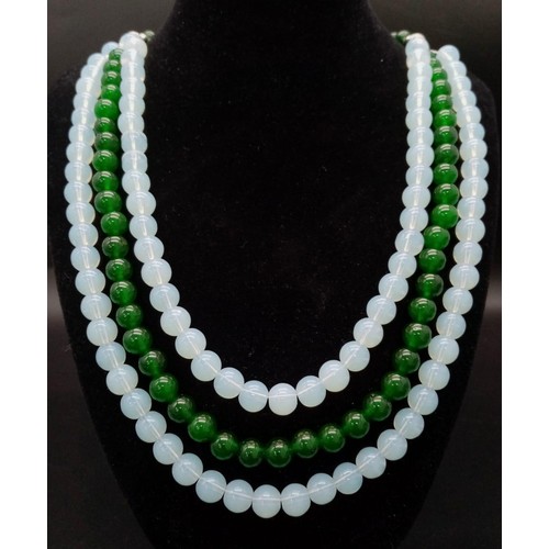 394 - A Stylish Jade and Moonstone Hanging Three Row Necklace. 56cm necklace length.