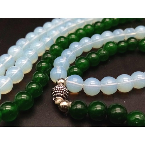 394 - A Stylish Jade and Moonstone Hanging Three Row Necklace. 56cm necklace length.