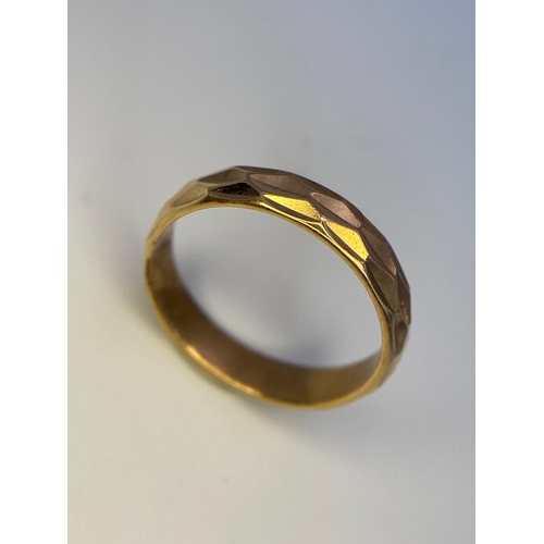 48 - A 9K Yellow Gold Faceted Band Ring. Size M. 2.9g weight.