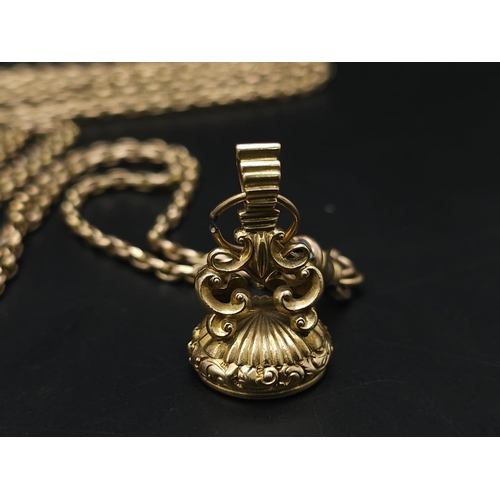 33 - An Antique 9K Yellow Gold Long Pocket Watch Chain with a Hanging 9K Yellow Gold Fob with Chalcedony ... 