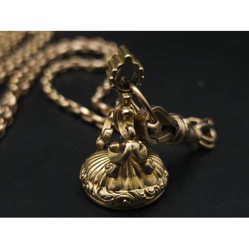 33 - An Antique 9K Yellow Gold Long Pocket Watch Chain with a Hanging 9K Yellow Gold Fob with Chalcedony ... 