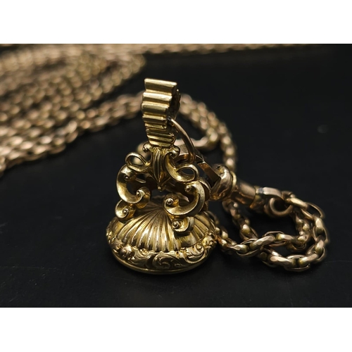 33 - An Antique 9K Yellow Gold Long Pocket Watch Chain with a Hanging 9K Yellow Gold Fob with Chalcedony ... 