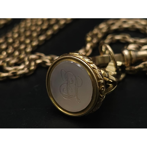 33 - An Antique 9K Yellow Gold Long Pocket Watch Chain with a Hanging 9K Yellow Gold Fob with Chalcedony ... 