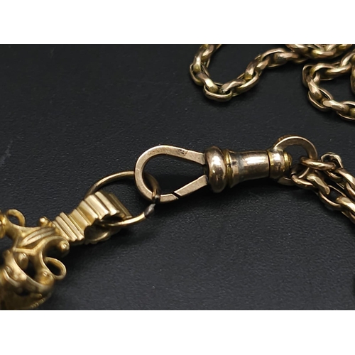 33 - An Antique 9K Yellow Gold Long Pocket Watch Chain with a Hanging 9K Yellow Gold Fob with Chalcedony ... 