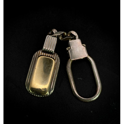 46 - A Vintage Sterling Silver and 18K Gold Key Ring. Constructed from different parts of previous jewell... 