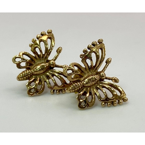 582 - A Pair of 9K Yellow Gold Decorative Butterfly Stud Earrings. 
2.1g total weight.