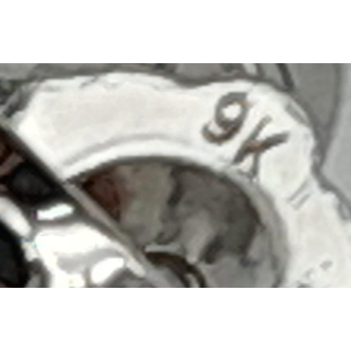 554 - A Pair of 18K White Gold Diamond Stud Earrings. 1g total weight.