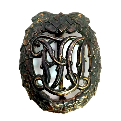 950 - 3rd Reich D.R.L Bronze Grade Sports Badge. Makers name on the rear.