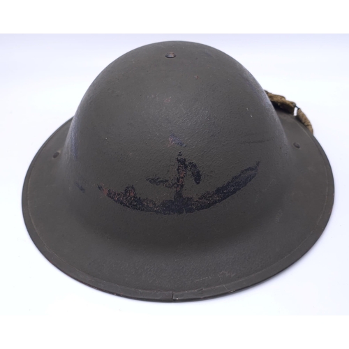 55 - 1943 Dated British MK II Helmet. Original Paint. Makers Marked RO & CO. With original chin strap... 