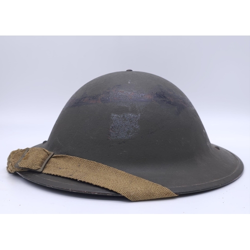 55 - 1943 Dated British MK II Helmet. Original Paint. Makers Marked RO & CO. With original chin strap... 