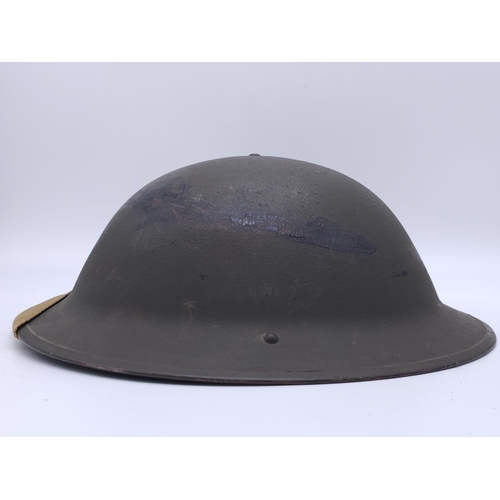 55 - 1943 Dated British MK II Helmet. Original Paint. Makers Marked RO & CO. With original chin strap... 