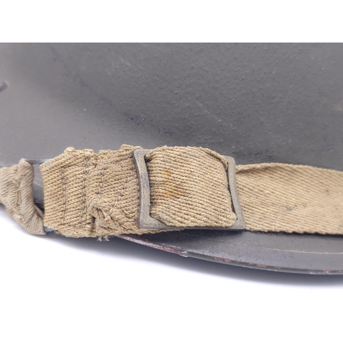 55 - 1943 Dated British MK II Helmet. Original Paint. Makers Marked RO & CO. With original chin strap... 