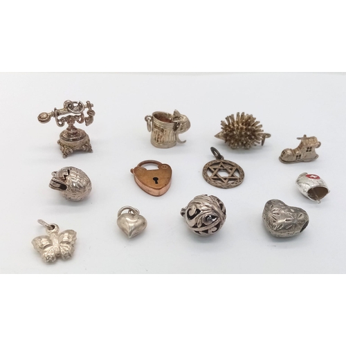 1763 - Assorted collection of white metal charms.
12 Charms in total. featuring a mouse climbing into a bin... 