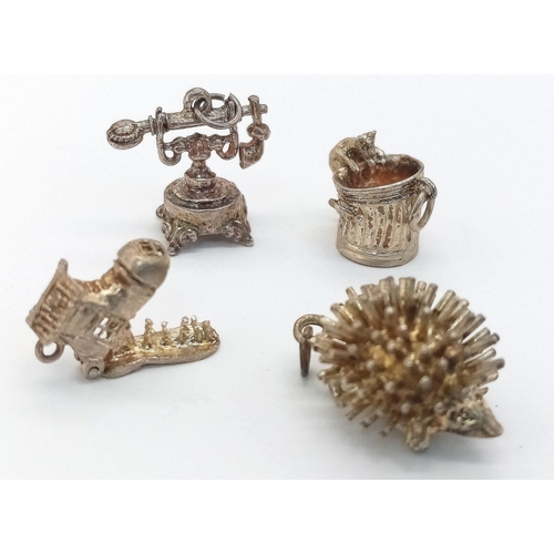 1763 - Assorted collection of white metal charms.
12 Charms in total. featuring a mouse climbing into a bin... 