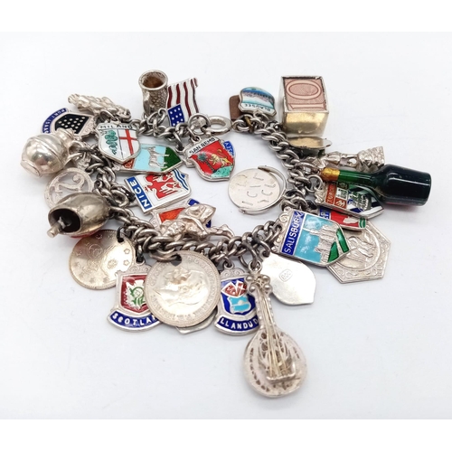 569 - Vintage Sterling Silver Charm Bracelet.
17cm in Length. Comprising 34 Silver Charms, including Count... 