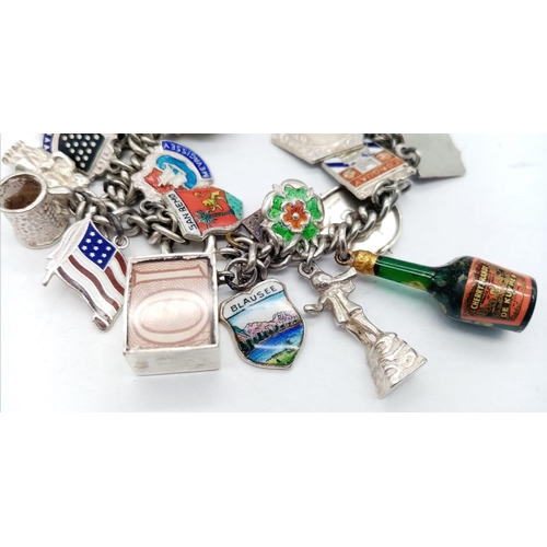 569 - Vintage Sterling Silver Charm Bracelet.
17cm in Length. Comprising 34 Silver Charms, including Count... 
