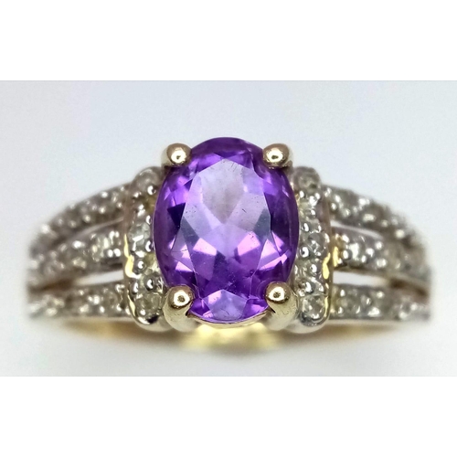 570 - A 9K YELLOW GOLD DIAMOND & AMETHYST SET RING. Size N, 3g total weight.