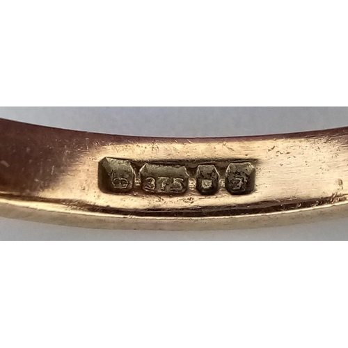 594 - A 9K YELLOW GOLD DIAMOND & SAPPHIRE RING. Size O, 3.1g total weight.