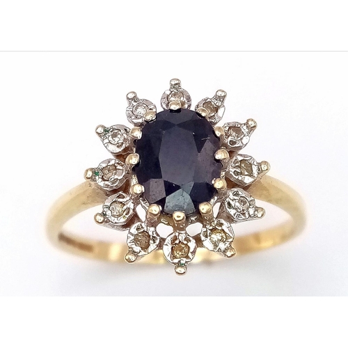 601 - A 9K YELLOW GOLD DIAMOND & SAPPHIRE CLUSTER RING. Size R, 2.5g total weight.