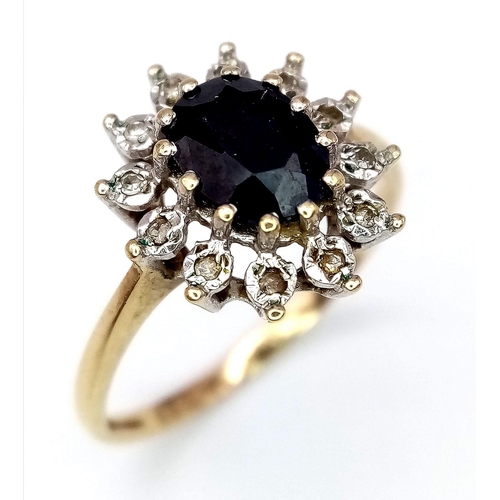 601 - A 9K YELLOW GOLD DIAMOND & SAPPHIRE CLUSTER RING. Size R, 2.5g total weight.