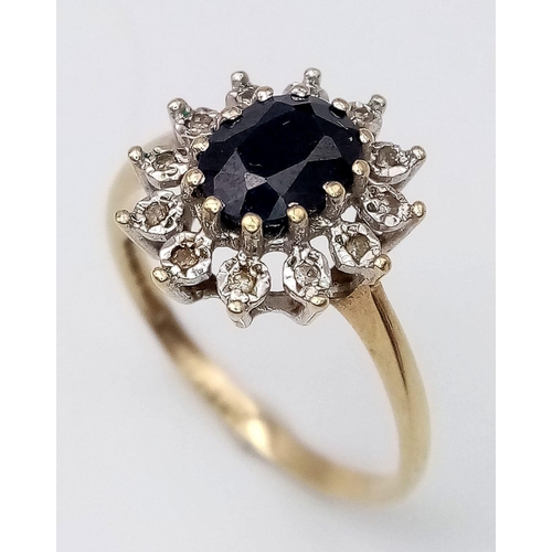 601 - A 9K YELLOW GOLD DIAMOND & SAPPHIRE CLUSTER RING. Size R, 2.5g total weight.
