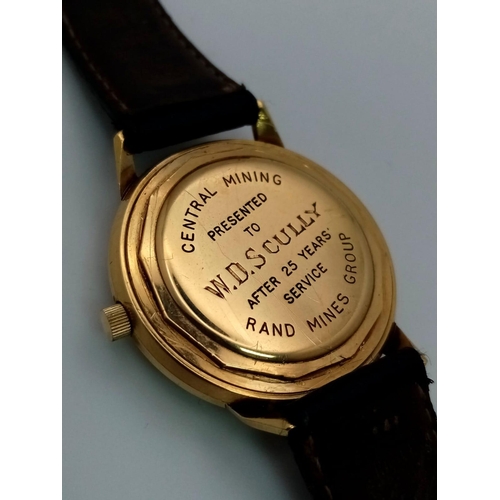 61 - 18K YELLOW GOLD ZENITH AUTOMATIC STRAP WATCH. 
ENGRAVED ON BACK AS IT WAS PRESENTED FOR 25 YEARS LON... 