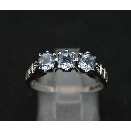 549 - A 9K WHITE GOLD DIAMOND & BLUE TOPAZ RING 3.1G SIZE O