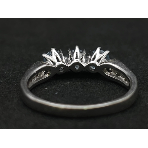 549 - A 9K WHITE GOLD DIAMOND & BLUE TOPAZ RING 3.1G SIZE O