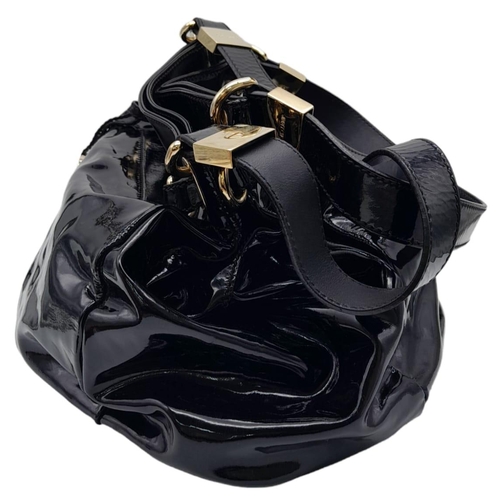 555 - Jimmy Choo Black Patent Leather Handbag.
Gorgeous feel to this handbag. Double strapped, with engrav... 