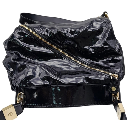 555 - Jimmy Choo Black Patent Leather Handbag.
Gorgeous feel to this handbag. Double strapped, with engrav... 
