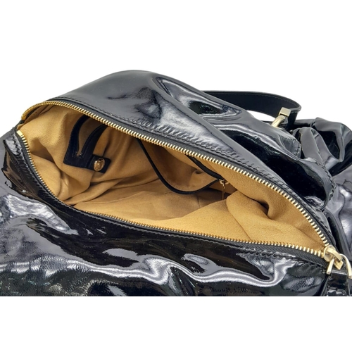 555 - Jimmy Choo Black Patent Leather Handbag.
Gorgeous feel to this handbag. Double strapped, with engrav... 