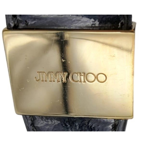 555 - Jimmy Choo Black Patent Leather Handbag.
Gorgeous feel to this handbag. Double strapped, with engrav... 