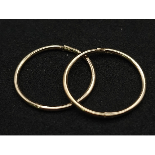 973 - A 9K YELLOW GOLD SLEEPER EARRINGS 0.8G 1.5CM