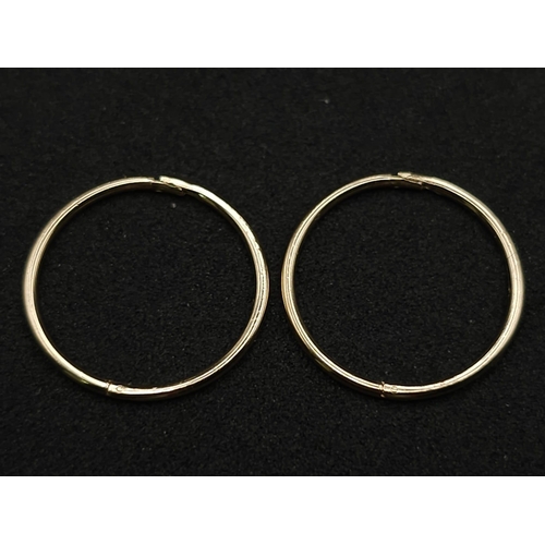 973 - A 9K YELLOW GOLD SLEEPER EARRINGS 0.8G 1.5CM