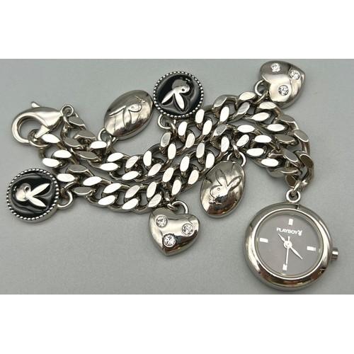 686 - A Playboy White Metal Charm Bracelet with a Playboy charm clock - in working order. 16cm