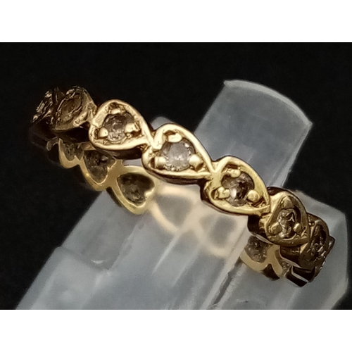 688 - A Vintage 9K Yellow Gold Heart-Shaped Band Ring. White stone decoration. Size L. 1.8g total weight.