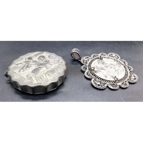 118 - TWO ITEMS: An antique silver filigree, Greek Orthodox religious pendant depicting Virgin Mary with h... 