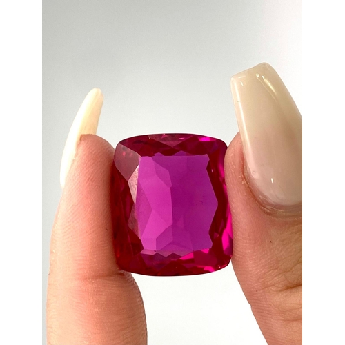 139 - A fabulous, large (51.3 carats), RUBY. Cushion cut, exhibiting strong fluorescence under UV light, e... 