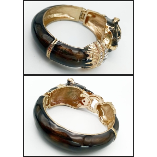 153 - A very glamorous, vintage, French designer style PANTHER bangle in a quality presentation box.