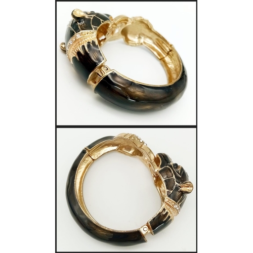 153 - A very glamorous, vintage, French designer style PANTHER bangle in a quality presentation box.