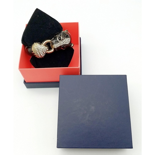 153 - A very glamorous, vintage, French designer style PANTHER bangle in a quality presentation box.