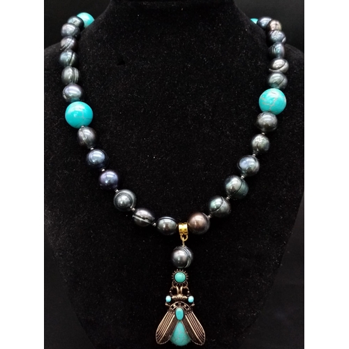 160 - A very unusual large, natural, Tahitian black pearl and turquoise necklace and earrings set, reminis... 