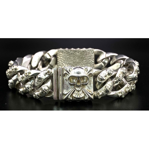 209 - A very desirable, sterling silver, probably of Buddhist significance, gents bracelet with sculls. We... 