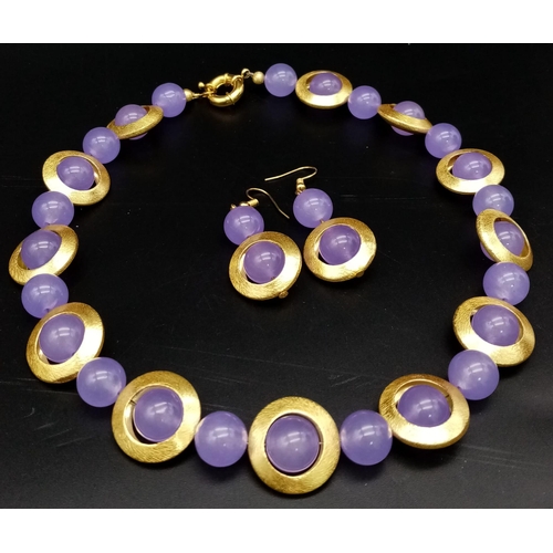 216 - A 60s style necklace with lavender jade beads surrounded by a gilded halo, accompanied by a pair of ... 