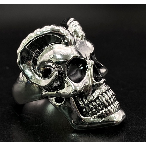 244 - TWO Biker’s rings: one is with a horned scull size S, the other one a folding “convincer” very popul... 