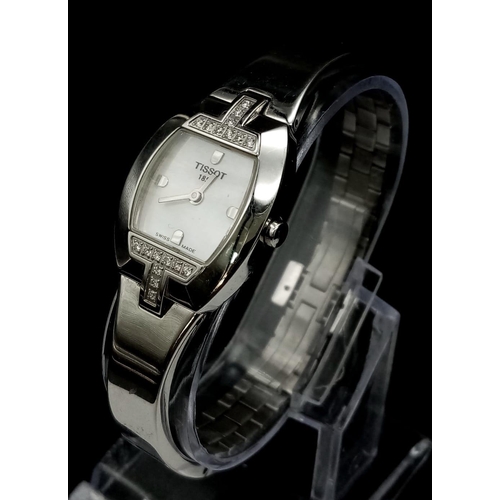 677 - A Tissot 1853 Diamond Ladies Watch. Stainless steel bracelet and case - 22mm. White dial. Two diamon... 