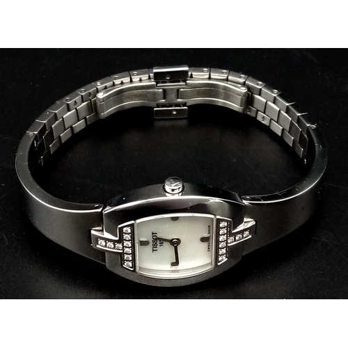 677 - A Tissot 1853 Diamond Ladies Watch. Stainless steel bracelet and case - 22mm. White dial. Two diamon... 